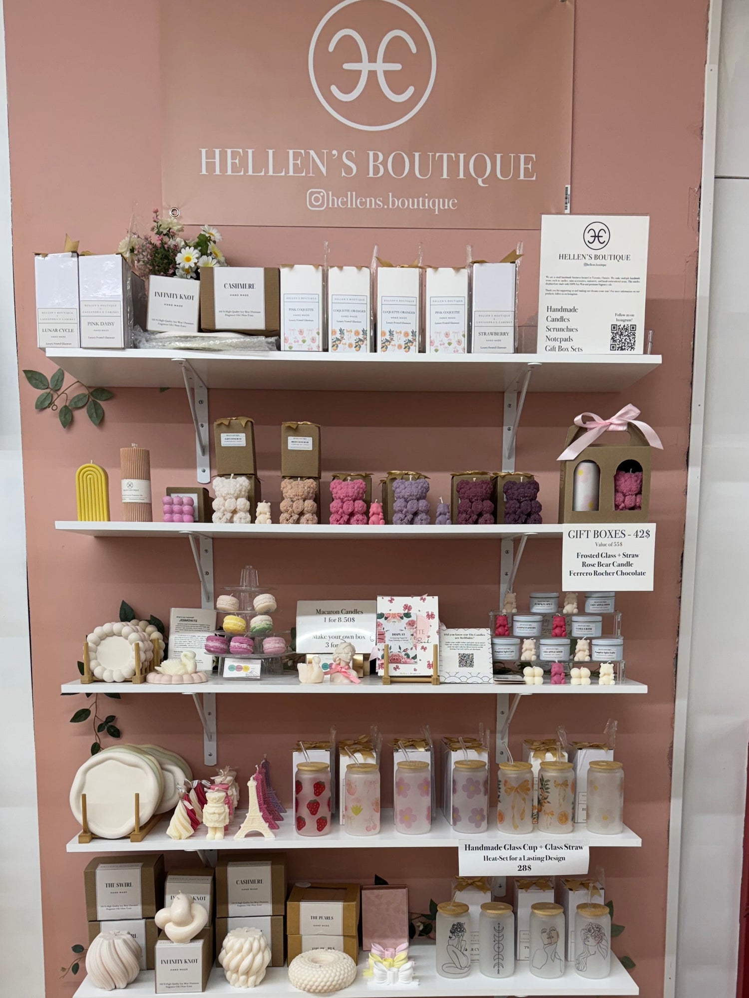 Display of products on shelves with a 'Hellen's Boutique' sign in the background.